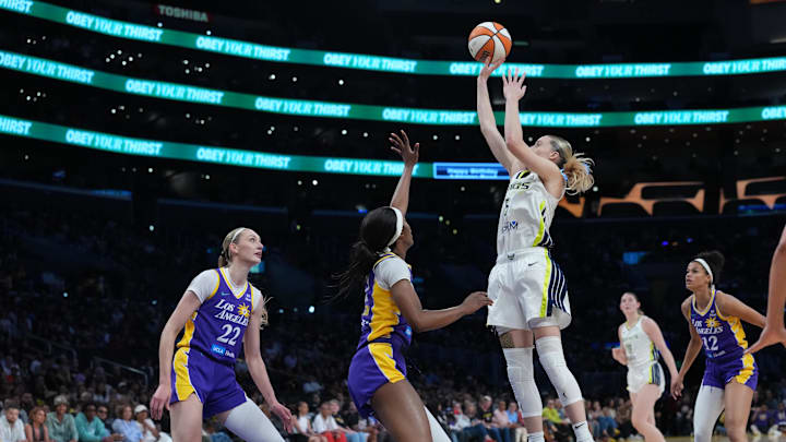 Aug 20, 2025; Los Angeles, California, USA; Dallas Wings guard Paige Bueckers (5) shoots the ball against LA Sparks forward Rickea Jackson (2) and forward Dearica Hamby (5) in the first half at Crypto.com Arena. Mandatory Credit: Kirby Lee-Imagn Images Aug 20, 2025; Los Angeles, California, USA; Dallas Wings guard Paige Bueckers (5) shoots the ball against LA Sparks forward Rickea Jackson (2) and forward Dearica Hamby (5) in the first half at Crypto.com Arena. Mandatory Credit: Kirby Lee-Imagn Images