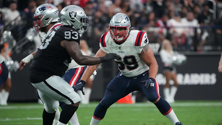 Aug 26, 2022; Paradise, Nevada, USA; New England Patriots guard Cole Strange (69) defends against Las Vegas Raiders defensive tackle Neil Farrell Jr. (93) at Allegiant Stadium. Mandatory Credit: Kirby Lee-Imagn Images