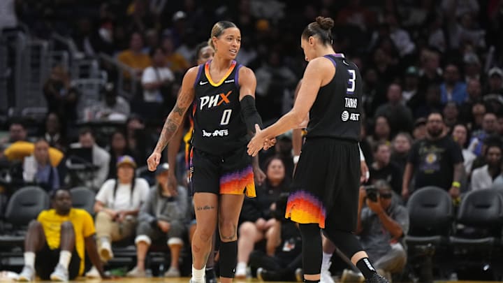 Sep 17, 2024; Los Angeles, California, USA; Phoenix Mercury guard Natasha Cloud (0) and guard Diana Taurasi (3) celebrate against the LA Sparks in the second half at Crypto.com Arena. Mandatory Credit: Kirby Lee-Imagn Images