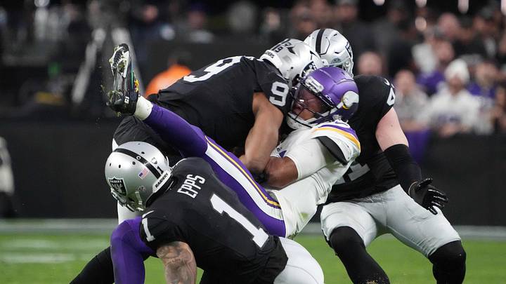 Dec 10, 2023; Paradise, Nevada, USA; Las Vegas Raiders defensive end Tyree Wilson (9), safety Marcus Epps (1) and linebacker Robert Spillane (41) tackle Minnesota Vikings quarterback Joshua Dobbs (15) in the second half at Allegiant Stadium. Mandatory Credit: Kirby Lee-USA TODAY Sports Dec 10, 2023; Paradise, Nevada, USA; Las Vegas Raiders defensive end Tyree Wilson (9), safety Marcus Epps (1) and linebacker Robert Spillane (41) tackle Minnesota Vikings quarterback Joshua Dobbs (15) in the second half at Allegiant Stadium. Mandatory Credit: Kirby Lee-USA TODAY Sports