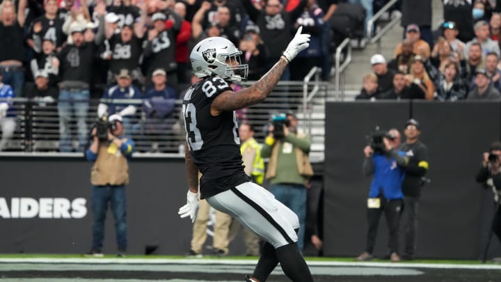 Dec 18, 2022; Paradise, Nevada, USA; Las Vegas Raiders tight end Darren Waller (83) scores on a 25-yard touchdown reception against the New England Patriots in the first half at Allegiant Stadium. The Raiders defeated the Patriots 30-24. Mandatory Credit: Kirby Lee-USA TODAY Sports