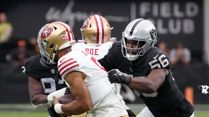 Aug 13, 2023; Paradise, Nevada, USA; Las Vegas Raiders linebacker Amari Burney (56) sacks San Francisco 49ers quarterback Trey Lance (5) in the first half at Allegiant Stadium. Mandatory Credit: Kirby Lee-USA TODAY Sports