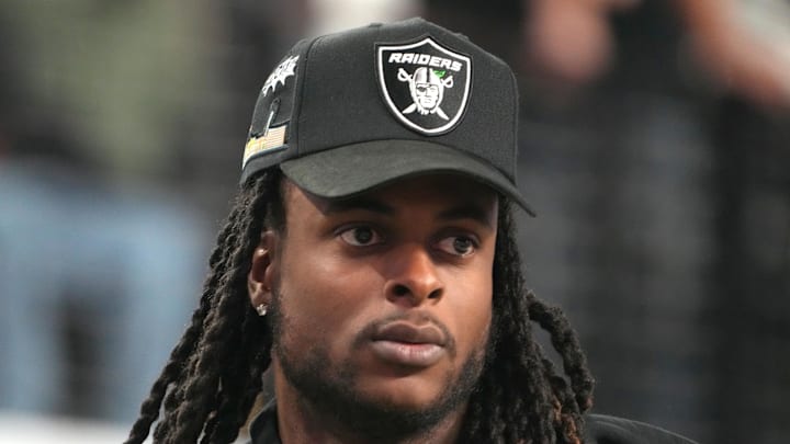 Dec 2, 2022; Las Vegas, NV, USA; Las Vegas Raiders receiver Davante Adams watches from the sidelines during the Pac-12 Championship at Allegiant Stadium. Mandatory Credit: Kirby Lee-USA TODAY Sports