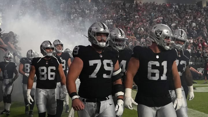 Aug 23, 2024; Paradise, Nevada, USA; Las Vegas Raiders guard Ben Brown (79) and guard Jordan Meredith (61) enter the field before the game against the San Francisco 49ers at Allegiant Stadium. Mandatory Credit: Kirby Lee-USA TODAY Sports