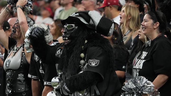 Oct 27, 2024; Paradise, Nevada, USA; Las Vegas Raiders fan Mark Acasio aka Gorilla Rilla (left) and Marilyn Acasio watch in the first half against the Kansas City Chiefs at Allegiant Stadium. Mandatory Credit: Kirby Lee-Imagn Images