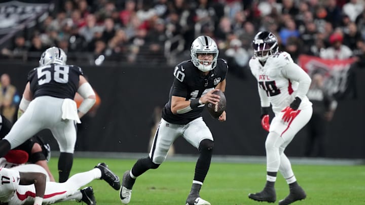 Dec 16, 2024; Paradise, Nevada, USA; Las Vegas Raiders quarterback Desmond Ridder (10) carries the ball against the Atlanta Falcons in the first half at Allegiant Stadium. Mandatory Credit: Kirby Lee-Imagn Images Dec 16, 2024; Paradise, Nevada, USA; Las Vegas Raiders quarterback Desmond Ridder (10) carries the ball against the Atlanta Falcons in the first half at Allegiant Stadium. Mandatory Credit: Kirby Lee-Imagn Images