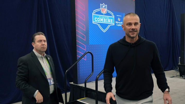 Feb 25, 2025; Indianapolis, IN, USA; Las Vegas Raiders communications vice president Will Kiss (left) escorts general manager John Spytek at the NFL Scouting Combine at the Indiana Convention Center. Mandatory Credit: Kirby Lee-Imagn Images