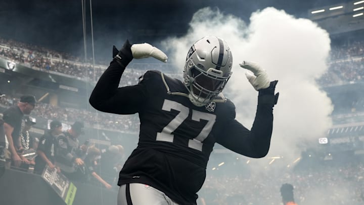 Sep 22, 2024; Paradise, Nevada, USA; Las Vegas Raiders offensive tackle Thayer Munford Jr. (77) enters the field before the game against the Carolina Panthers at Allegiant Stadium. Mandatory Credit: Kirby Lee-Imagn Images