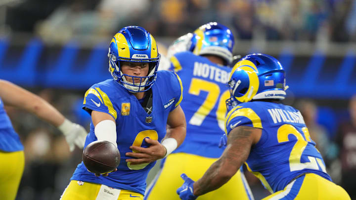 Nov 11, 2024; Inglewood, California, USA; Los Angeles Rams quarterback Matthew Stafford (9) hands the ball off to running back Kyren Williams (23) against the Miami Dolphins in the first half at SoFi Stadium. Mandatory Credit: Kirby Lee-Imagn Images