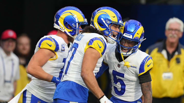 Dec 3, 2023; Inglewood, California, USA;Los Angeles Rams wide receiver Puka Nacua (17) celebrates with wide receiver Cooper Kupp (10) and wide receiver Tutu Atwell (5) after scoring on a 70-yard touchdown reception against the Cleveland Browns in the first half at SoFi Stadium. Mandatory Credit: Kirby Lee-Imagn Images