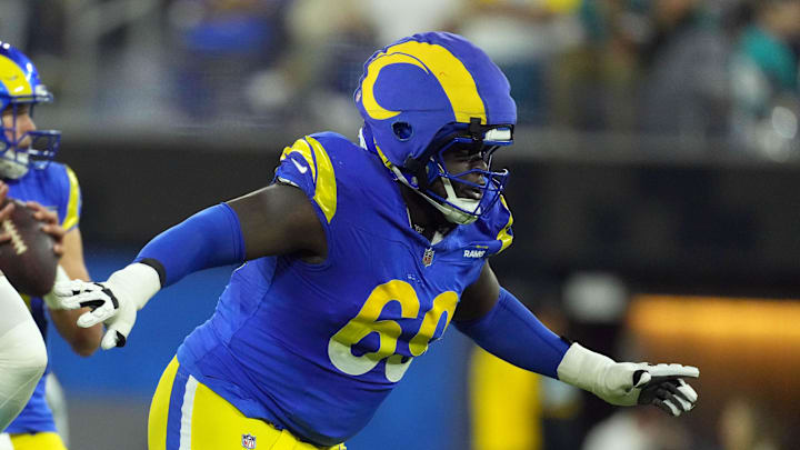 Nov 11, 2024; Inglewood, California, USA; Los Angeles Rams guard Kevin Dotson (69) wears a Guardian helmet cap in the second half against the Miami Dolphins at SoFi Stadium. Mandatory Credit: Kirby Lee-Imagn Images