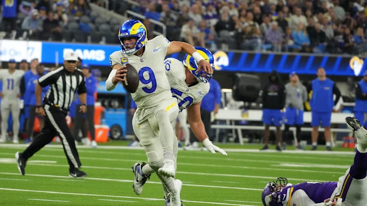 Oct 24, 2024; Inglewood, California, USA; Los Angeles Rams quarterback Matthew Stafford (9) carries the ball against the Minnesota Vikings in the first half at SoFi Stadium. Mandatory Credit: Kirby Lee-Imagn Images