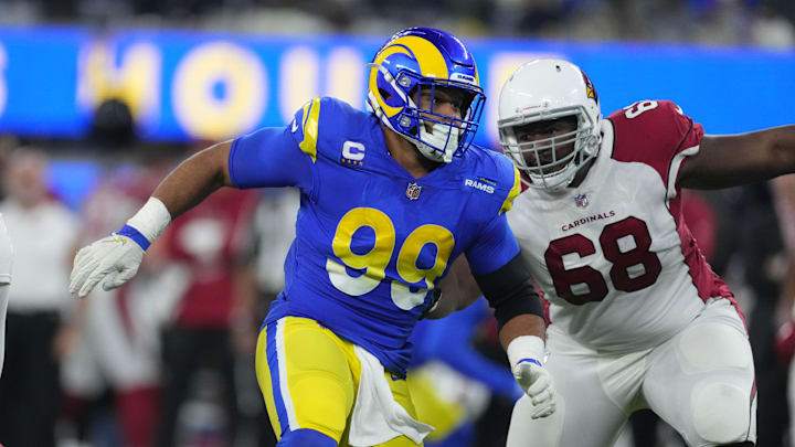 Jan 17, 2022; Inglewood, California, USA; Los Angeles Rams defensive end Aaron Donald (99) rushes past Arizona Cardinals offensive tackle Kelvin Beachum (68) during the second half of an NFC Wild Card playoff football game at SoFi Stadium. The Rams defeated the Cardinals 34-11. Mandatory Credit: Kirby Lee-Imagn Images