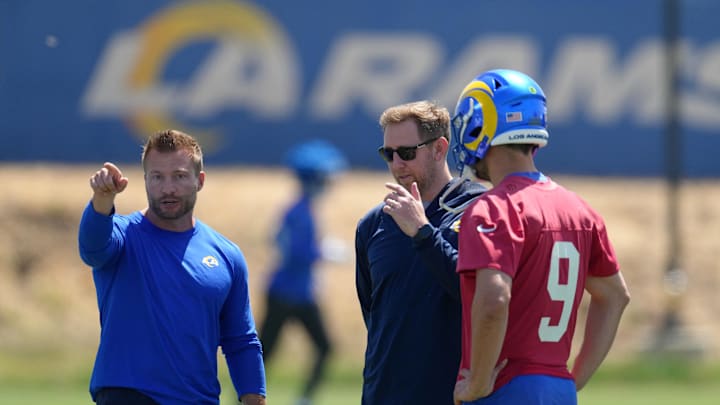 May 23, 2022; Thousand Oaks, CA, USA; Los Angeles Rams coach Sean McVay (left), offensive coordinator Liam Coen (center) and quarterback Matthew Stafford (9) during organized team activities at California Lutheran University. Mandatory Credit: Kirby Lee-Imagn Images