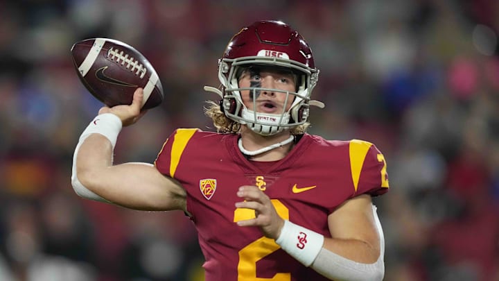 Nov 27, 2021; Los Angeles, California, USA; Southern California Trojans quarterback Jaxson Dart (2) throws the ball against the BYU Cougars in the first half at United Airlines Field at Los Angeles Memorial Coliseum. Mandatory Credit: Kirby Lee-Imagn Images Nov 27, 2021; Los Angeles, California, USA; Southern California Trojans quarterback Jaxson Dart (2) throws the ball against the BYU Cougars in the first half at United Airlines Field at Los Angeles Memorial Coliseum. Mandatory Credit: Kirby Lee-Imagn Images