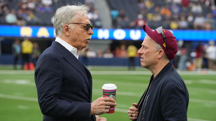 Dec 17, 2023; Inglewood, California, USA; Los Angeles Rams owner Stan Kroenke (left) talks with Washington Commanders owner Josh Harris during the game at SoFi Stadium. Mandatory Credit: Kirby Lee-Imagn Images