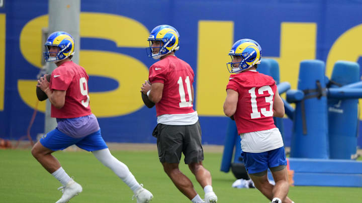 May 28, 2025; Woodland Hills, CA, USA; Los Angeles Rams quarterbacks Matthew Stafford (9), Jimmy Garoppolo (11) and Stetson Bennett (13) throw the ball during organized team activities at Rams Practice Facility. Mandatory Credit: Kirby Lee-Imagn Images