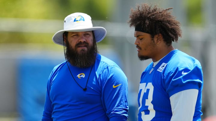 May 21, 2024, Thousand Oaks, California, USA; Los Angeles Rams offensive line coach Ryan Wendell (left) and lineman Steve Avila (73) during organized team activities at Cal Lutheran University. Mandatory Credit: Kirby Lee-Imagn Images