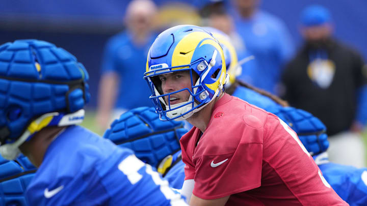 May 28, 2025; Woodland Hills, CA, USA; Los Angeles Rams quarterback Matthew Stafford (9) prepares to take the snap during organized team activities at Rams Practice Facility. Mandatory Credit: Kirby Lee-Imagn Images