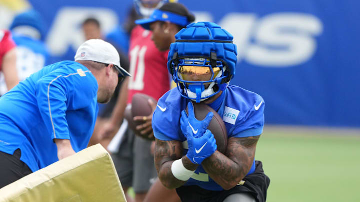 Jun 3, 2025; Woodland Hills, CA, USA; Los Angeles Rams running back Kyren Williams (23) carries the ball during organized team activities at Rams Practice Facility. Mandatory Credit: Kirby Lee-Imagn Images