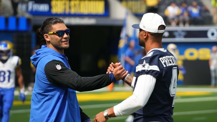 Aug 9, 2025; Inglewood, California, USA; Dallas Cowboys quarterback Dak Prescott (4) shakes hands with wide receiver Puka Nacua during the game at SoFi Stadium. Mandatory Credit: Kirby Lee-Imagn Images
