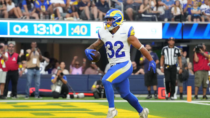 Aug 9, 2025; Inglewood, California, USA; Los Angeles Rams running back Cody Schrader (32) scores on a 9-yard touchdown reception in the fourth quarter against the Dallas Cowboys at SoFi Stadium. Mandatory Credit: Kirby Lee-Imagn Images