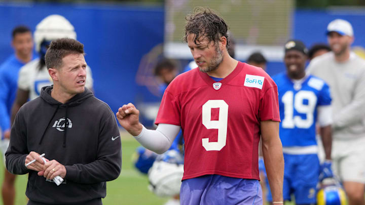 May 28, 2025; Woodland Hills, CA, USA; Los Angeles Rams offensive coordinator Mike LaFleur (left) talks with quarterback Matthew Stafford (9) during organized team activities at Rams Practice Facility. Mandatory Credit: Kirby Lee-Imagn Images