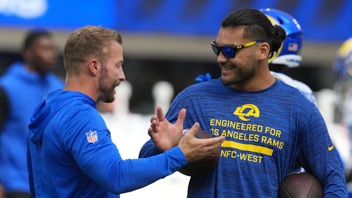 Aug 16, 2025; Inglewood, California, USA; Los Angeles Rams coach Sean McVay (left) talks with wide receiver Puka Nacua (12) against the Los Angeles Chargers in the first half at SoFi Stadium. Mandatory Credit: Kirby Lee-Imagn Images
