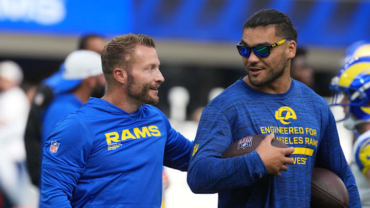 Aug 16, 2025; Inglewood, California, USA; Los Angeles Rams coach Sean McVay (left) talks with wide receiver Puka Nacua (12) against the Los Angeles Chargers in the first half at SoFi Stadium. Mandatory Credit: Kirby Lee-Imagn Images