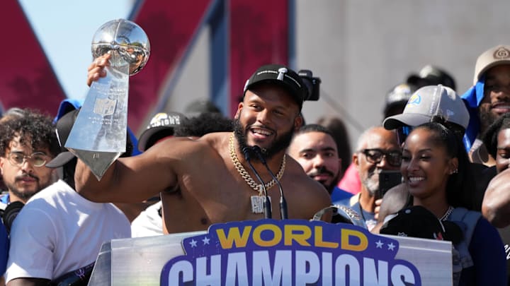 Feb 16, 2022; Los Angeles, CA, USA; Los Angeles Rams defensive end Aaron Donald holds the Vince Lombardi trophy during the Super Bowl LVI championship rally at the Los Angeles Memorial Coliseum. Mandatory Credit: Kirby Lee-Imagn Images Feb 16, 2022; Los Angeles, CA, USA; Los Angeles Rams defensive end Aaron Donald holds the Vince Lombardi trophy during the Super Bowl LVI championship rally at the Los Angeles Memorial Coliseum. Mandatory Credit: Kirby Lee-Imagn Images