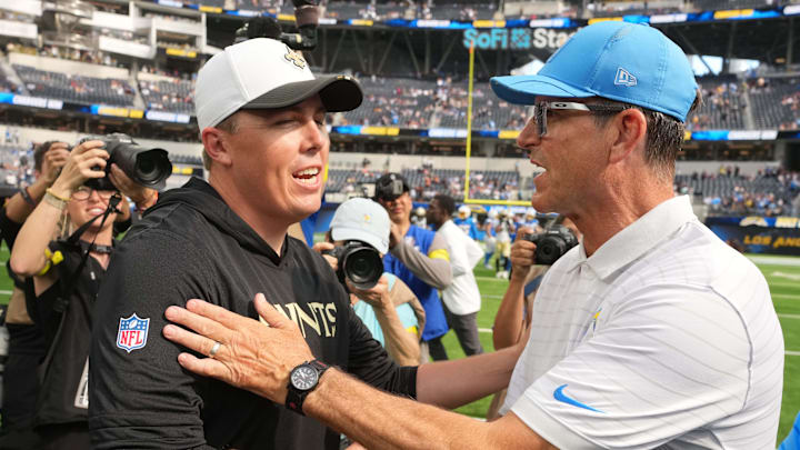 Aug 10, 2025; Inglewood, California, USA; New Orleans Saints coach Kellen Moore (left) and Los Angeles Chargers coach Jim Harbaugh shake hands after the game at SoFi Stadium. Mandatory Credit: Kirby Lee-Imagn Images Aug 10, 2025; Inglewood, California, USA; New Orleans Saints coach Kellen Moore (left) and Los Angeles Chargers coach Jim Harbaugh shake hands after the game at SoFi Stadium. Mandatory Credit: Kirby Lee-Imagn Images