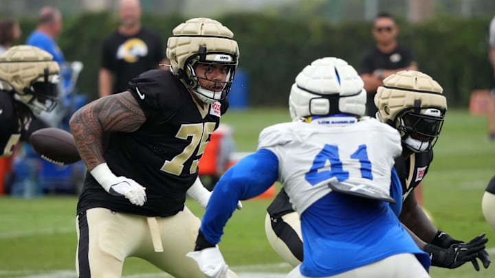 Aug 14, 2025; Carson, CA, USA; New Orleans Saints offensive tackle Taliese Fuaga (75) defends against Los Angeles Rams linebacker Josaiah Stewart (41) during a joint practice at the Dignity Health Sports Park. Mandatory Credit: Kirby Lee-Imagn Images Aug 14, 2025; Carson, CA, USA; New Orleans Saints offensive tackle Taliese Fuaga (75) defends against Los Angeles Rams linebacker Josaiah Stewart (41) during a joint practice at the Dignity Health Sports Park. Mandatory Credit: Kirby Lee-Imagn Images