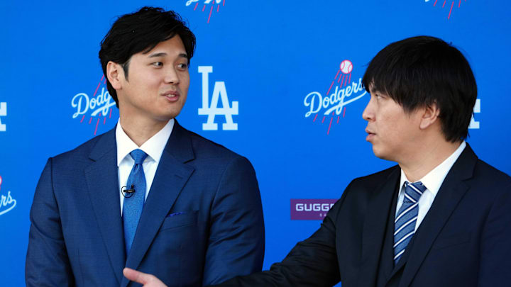 Dec 14, 2023; Los Angeles, CA, USA; Los Angeles Dodgers designated hitter Shohei Ohtan (left) speaks to interpreter Ippei Mizuhara at introductory press conference at Dodger Stadium. Mandatory Credit: Kirby Lee-USA TODAY Sports Dec 14, 2023; Los Angeles, CA, USA; Los Angeles Dodgers designated hitter Shohei Ohtan (left) speaks to interpreter Ippei Mizuhara at introductory press conference at Dodger Stadium. Mandatory Credit: Kirby Lee-USA TODAY Sports