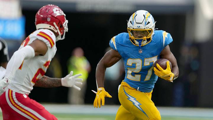 Sep 29, 2024; Inglewood, California, USA; Los Angeles Chargers running back J.K. Dobbins (27) carries the ball in the first quarter against the Kansas City Chiefs at SoFi Stadium. Mandatory Credit: Kirby Lee-Imagn Images
