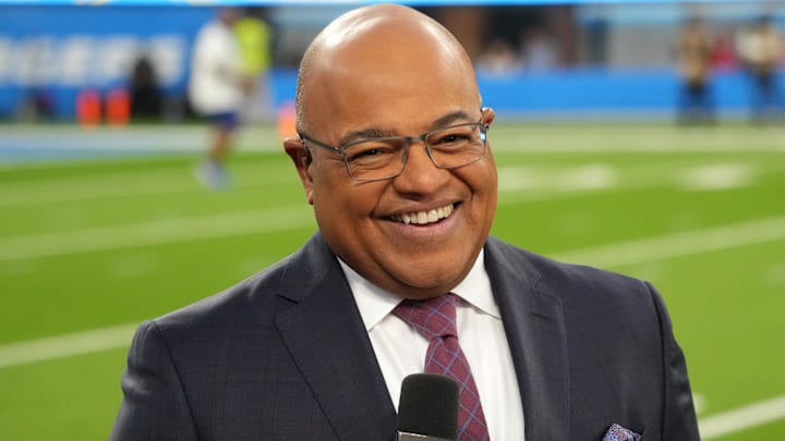 NBC Sunday Night Football broadcaster Mike Tirico works an NFL game in 2022.