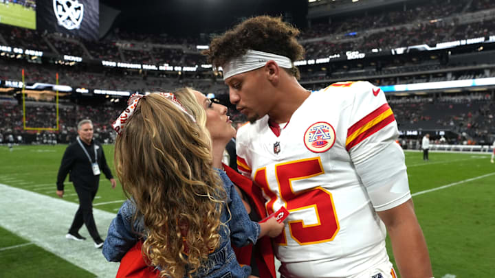 Oct 27, 2024: Kansas City Chiefs quarterback Patrick Mahomes kisses wife Brittany Mahomes and daughter Sterling.