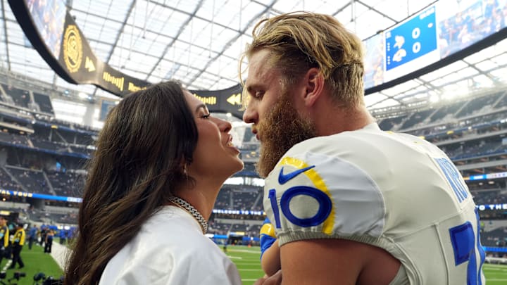 Los Angeles Rams wide receiver Cooper Kupp kisses his wife Anna Kupp during the game against the Minnesota Vikings.