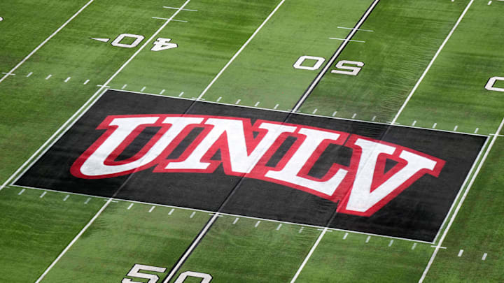 The UNLV Rebels logo at midfield during the Mountain West Championship at Allegiant Stadium. Mandatory Credit: Kirby Lee-Imagn Images The UNLV Rebels logo at midfield during the Mountain West Championship at Allegiant Stadium. Mandatory Credit: Kirby Lee-Imagn Images
