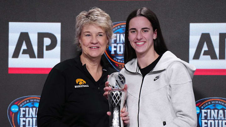 Apr 4, 2024; Cleveland, OH, USA; Iowa Hawkeyes guard Caitlin Clark poses with coach Lisa Bluder after being selected as the AP Player of the Year at a press conference at Rocket Mortgage FieldHouse. Mandatory Credit: Kirby Lee-Imagn Images Apr 4, 2024; Cleveland, OH, USA; Iowa Hawkeyes guard Caitlin Clark poses with coach Lisa Bluder after being selected as the AP Player of the Year at a press conference at Rocket Mortgage FieldHouse. Mandatory Credit: Kirby Lee-Imagn Images