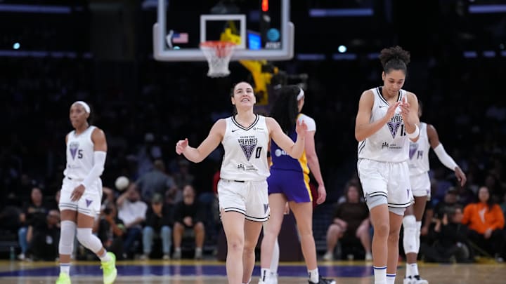 Jun 9, 2025; Los Angeles, California, USA; Golden State Valkyries guard Carla Leite (0) and forward Janelle Salaun (13) celebrate in overtime against the LA Sparks at Crypto.com Arena. Mandatory Credit: Kirby Lee-Imagn Images