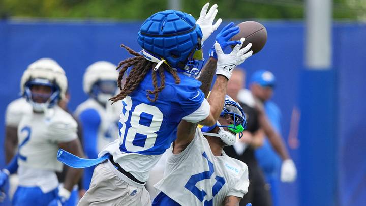 Jun 3, 2025; Woodland Hills, CA, USA; Los Angeles Rams cornerback Charles Woods (21) deflects a pass against receiver Jordan Whittington (88) during organized team activities at Rams Practice Facility. Mandatory Credit: Kirby Lee-Imagn Images Jun 3, 2025; Woodland Hills, CA, USA; Los Angeles Rams cornerback Charles Woods (21) deflects a pass against receiver Jordan Whittington (88) during organized team activities at Rams Practice Facility. Mandatory Credit: Kirby Lee-Imagn Images