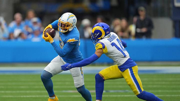 Jan 1, 2023; Inglewood, California, USA; Los Angeles Chargers wide receiver Keenan Allen (13) catches the ball against Los Angeles Rams cornerback Cobie Durant (14) in the first half at SoFi Stadium. Mandatory Credit: Kirby Lee-USA TODAY Sports Jan 1, 2023; Inglewood, California, USA; Los Angeles Chargers wide receiver Keenan Allen (13) catches the ball against Los Angeles Rams cornerback Cobie Durant (14) in the first half at SoFi Stadium. Mandatory Credit: Kirby Lee-USA TODAY Sports