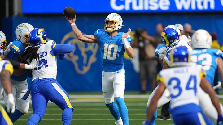 Aug 16, 2025; Inglewood, California, USA; Los Angeles Chargers quarterback Justin Herbert (10) throws the ball against the Los Angeles Rams in the first half at SoFi Stadium. Mandatory Credit: Kirby Lee-Imagn Images