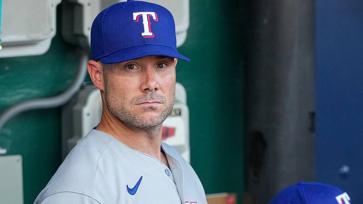 Jun 9, 2026; Kansas City, Missouri, USA; Texas Rangers manager Skip Schumaker (55) looks out from the dugout prior to a game against the Kansas City Royals at Kauffman Stadium. Mandatory Credit: Denny Medley-Imagn Images Jun 9, 2026; Kansas City, Missouri, USA; Texas Rangers manager Skip Schumaker (55) looks out from the dugout prior to a game against the Kansas City Royals at Kauffman Stadium. Mandatory Credit: Denny Medley-Imagn Images