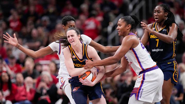 Phoenix Mercury forward Alyssa Thomas (25) attempts to strip the ball from Indiana Fever guard Caitlin Clark (22) on Monday, June 22, 2026, during the game at Gainbridge Fieldhouse in Indianapolis. The Indiana Fever defeated the Phoenix Mercury, 86-77.
