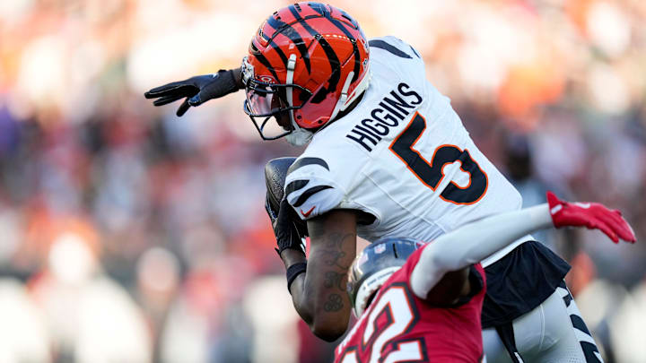 Cincinnati Bengals wide receiver Tee Higgins (5) breaks away from Tampa Bay Buccaneers safety Josh Hayes (32) on his way to the end zone on a catch in the first quarter of the NFL Preseason Week 1 game between the Cincinnati Bengals and the Tampa Bay Buccaneers at Paycor Stadium in downtown Cincinnati on Saturday, Aug. 10, 2024.