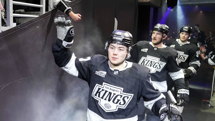 Jan 22, 2025; Los Angeles, California, USA; LA Kings defenseman Jordan Spence (21) enters the ice against the Florida Panthers at Crypto.com Arena. Mandatory Credit: Kirby Lee-Imagn Images