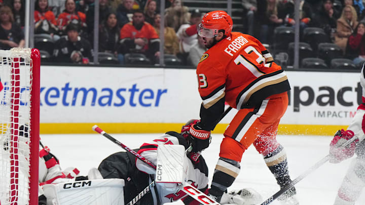 Dec 31, 2024; Anaheim, California, USA; Anaheim Ducks center Robby Fabbri (13) scores a goal against New Jersey Devils goaltender Jacob Markstrom (25) in the third period at Honda Center. Mandatory Credit: Kirby Lee-Imagn Images