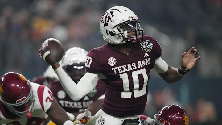Dec 27, 2024; Las Vegas, NV, USA; Texas A&M Aggies quarterback Marcel Reed (10) throws the ball against Southern California Trojans cornerback John Humphrey (19) in the first half at Allegiant Stadium. Mandatory Credit: Kirby Lee-Imagn Images Dec 27, 2024; Las Vegas, NV, USA; Texas A&M Aggies quarterback Marcel Reed (10) throws the ball against Southern California Trojans cornerback John Humphrey (19) in the first half at Allegiant Stadium. Mandatory Credit: Kirby Lee-Imagn Images