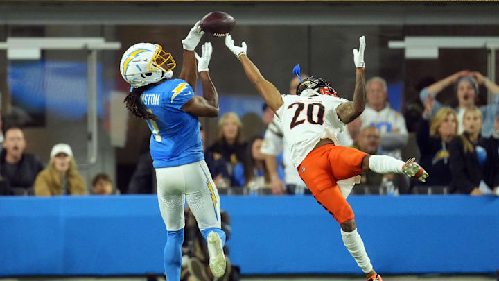 Nov 17, 2024; Inglewood, California, USA; Los Angeles Chargers wide receiver Quentin Johnston (1) attempts to catch the ball against Cincinnati Bengals cornerback DJ Turner II (20) in the second half at SoFi Stadium. Mandatory Credit: Kirby Lee-Imagn Images Nov 17, 2024; Inglewood, California, USA; Los Angeles Chargers wide receiver Quentin Johnston (1) attempts to catch the ball against Cincinnati Bengals cornerback DJ Turner II (20) in the second half at SoFi Stadium. Mandatory Credit: Kirby Lee-Imagn Images